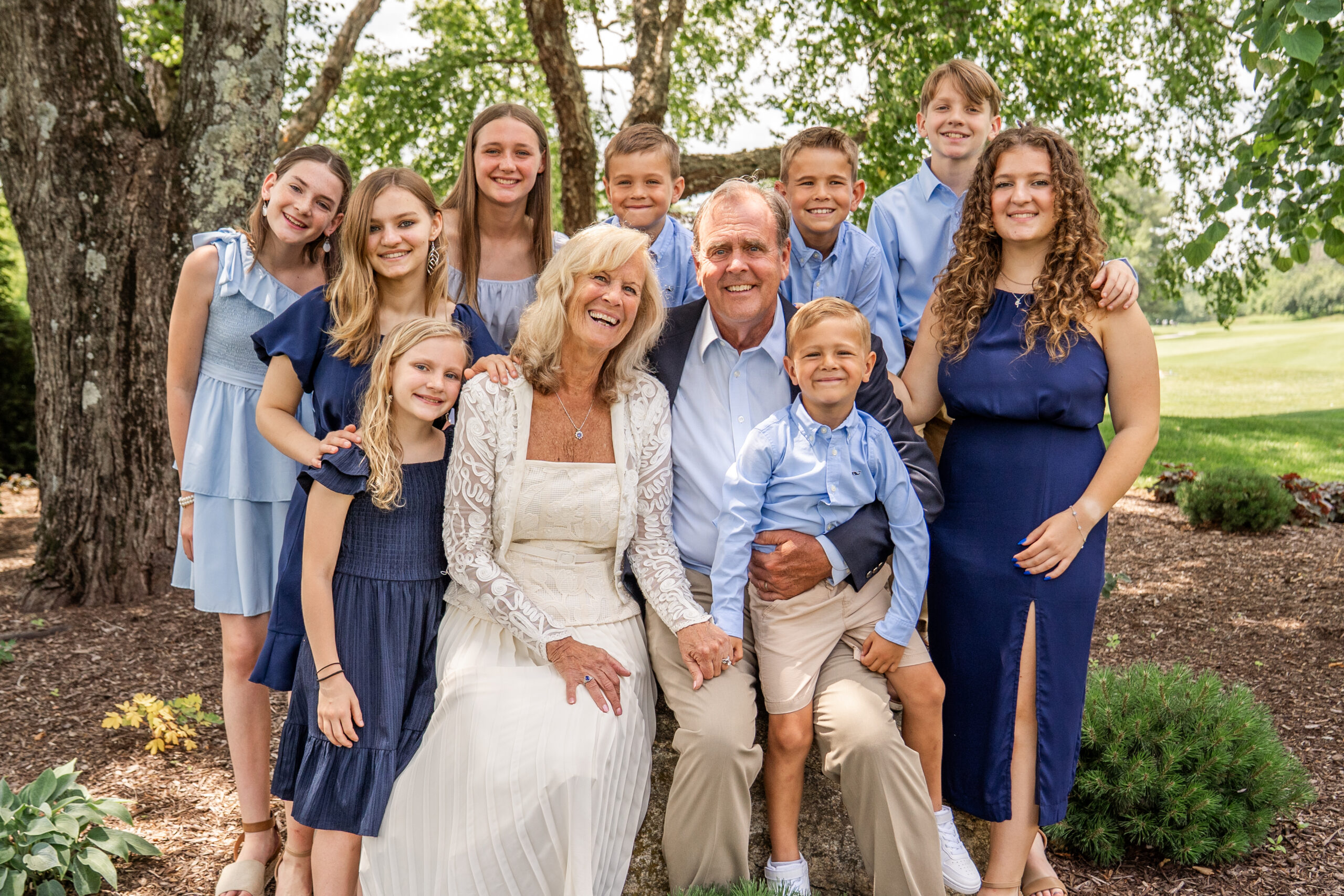 Mike & Denise Litzau with their nine grandkids at Turf Valley Resort.